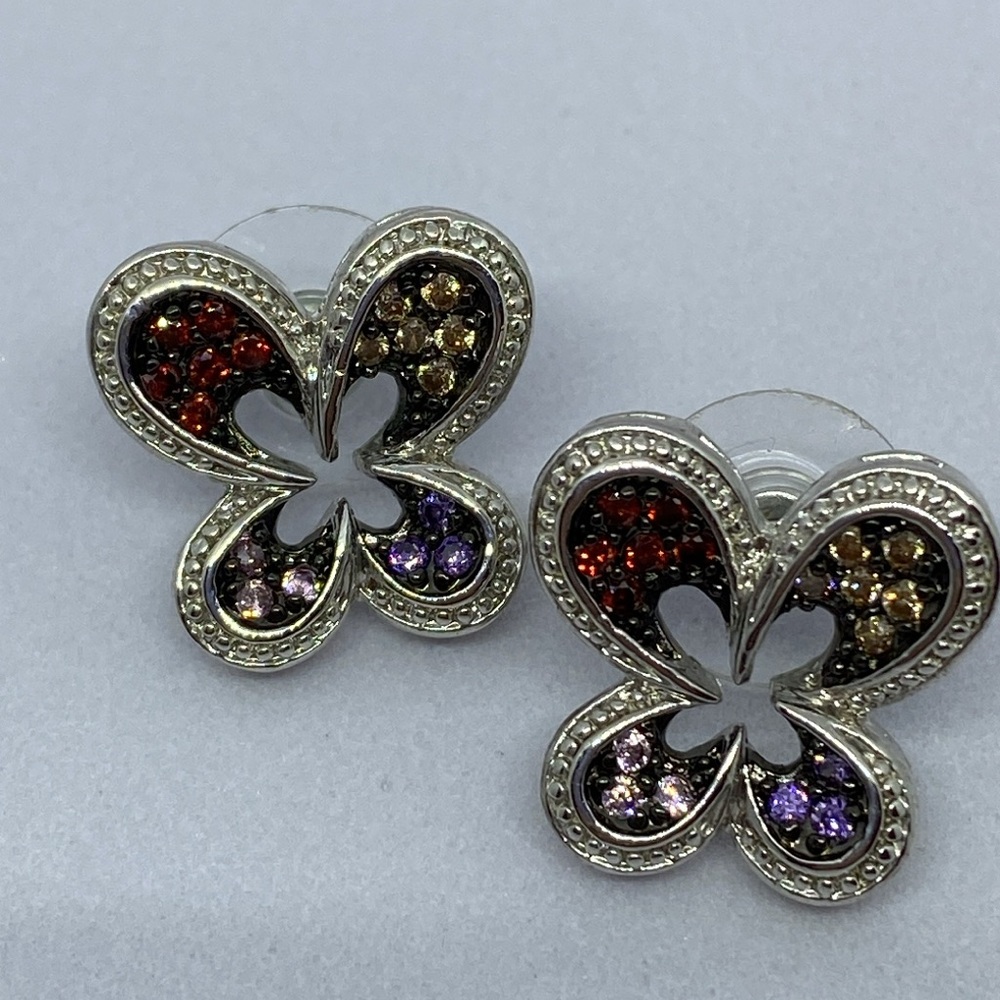 Silver tone CZ pierced earrings.